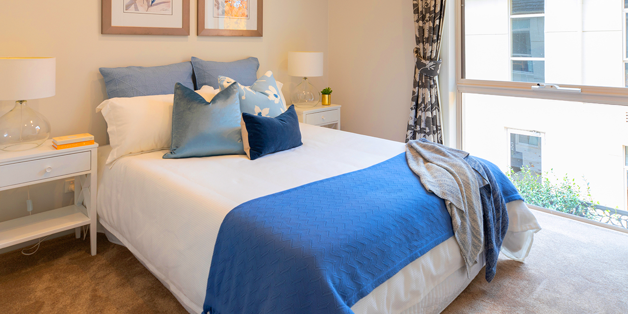 Hedley Sutton Retirement Living white and blue bed